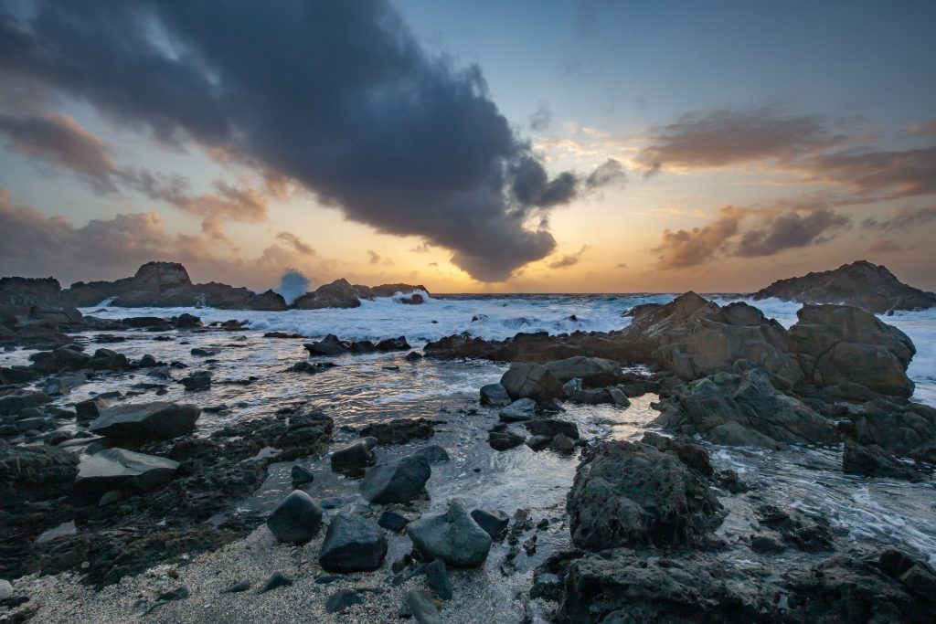 This is an image taken at sunrise on the rocky coast of Eastern Aruba